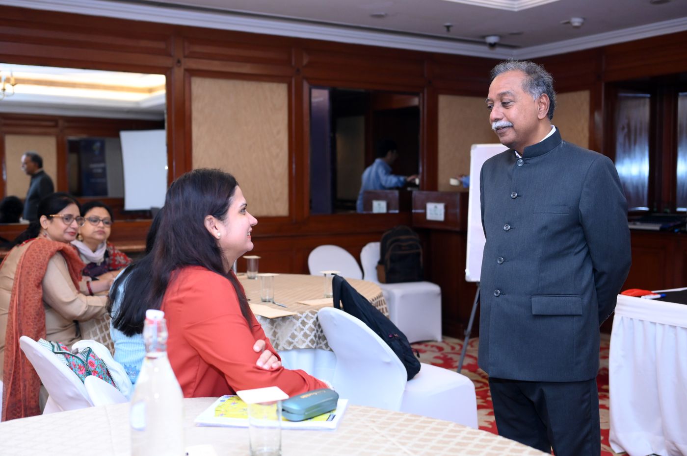 Dr. Louis in conversation with a participant