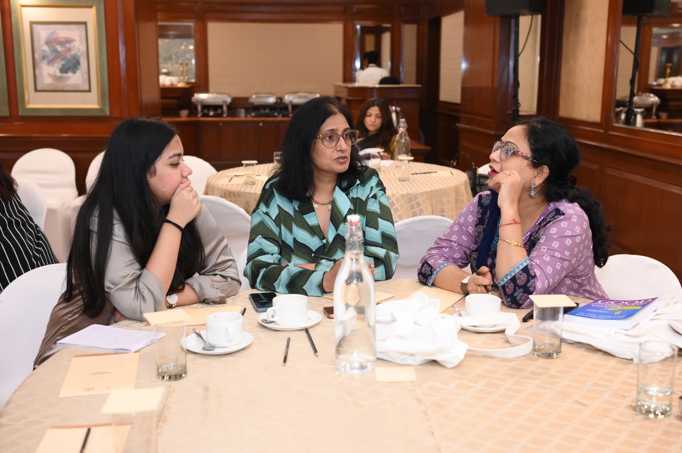 Participants in discussion in small groups